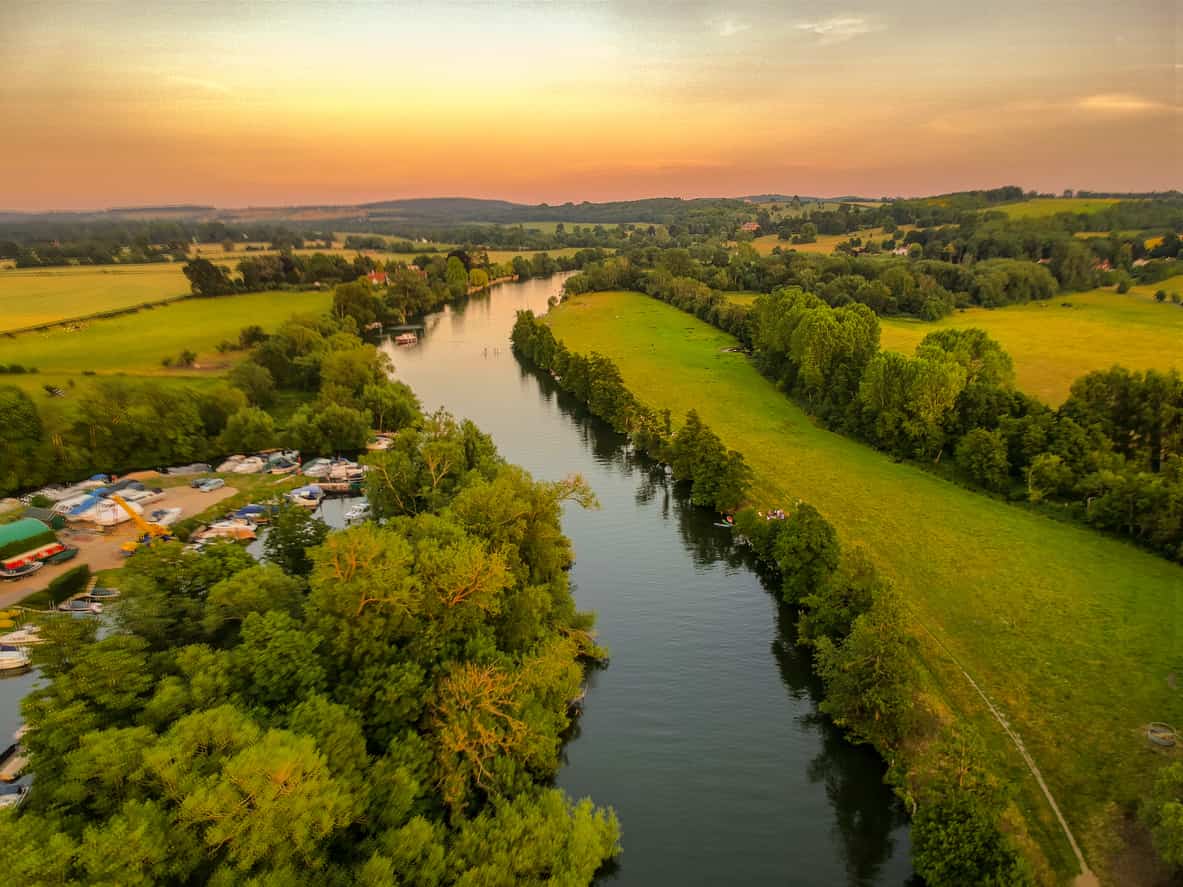 Overview of a river as the sun is setting