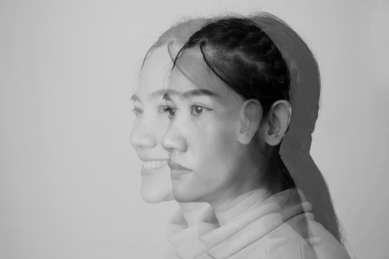 Dissociative disorders - an double exposure close up image of a woman who internally suffering from dissociative identity disorder. 