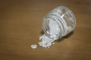 What is Flakka? An image of flakka in a jar on a table.