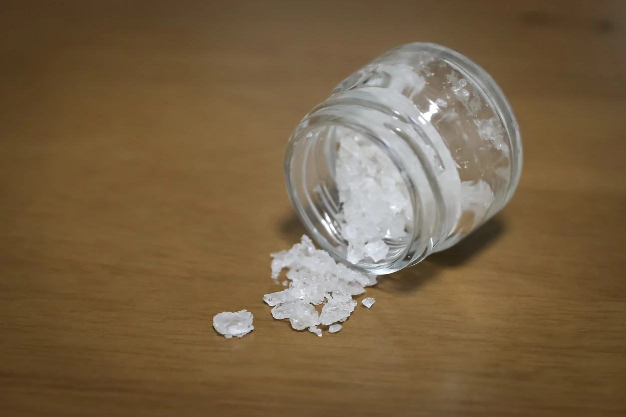 What is Flakka? An image of flakka in a jar on a table.