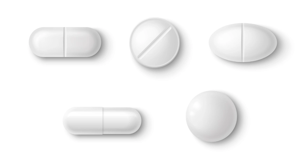 what are orphines? An image of white pill tablets in different shapes